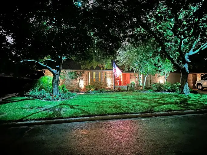 Landscape lighting by TC Lighting in Arlington, TX — photographed after dark on the property