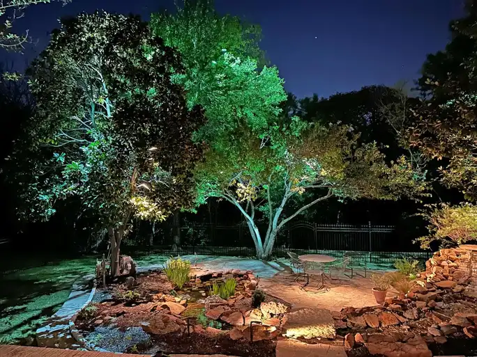 Landscape lighting by TC Lighting in Colleyville, TX — photographed after dark on the property