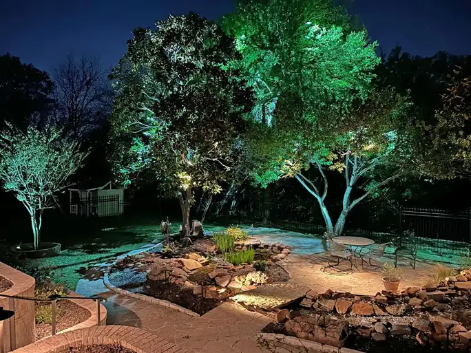 Landscape lighting by TC Lighting in Colleyville, TX — photographed after dark on the property