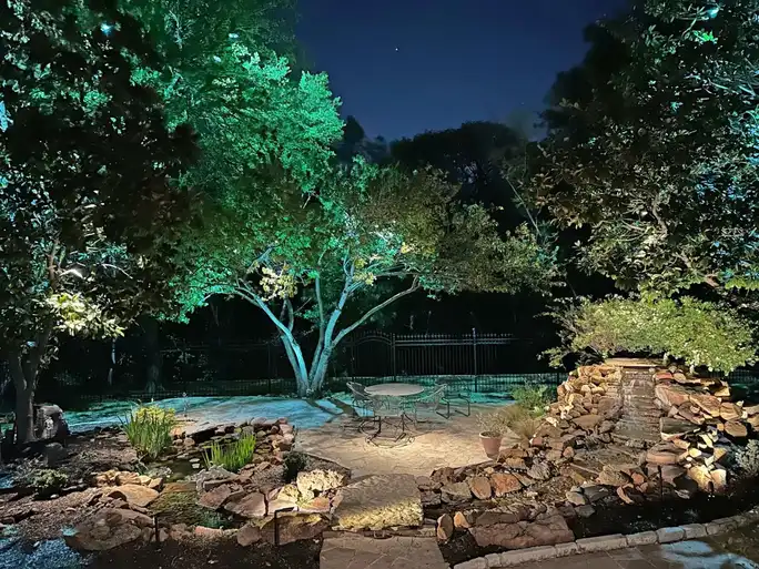 Landscape lighting by TC Lighting in Colleyville, TX — photographed after dark on the property