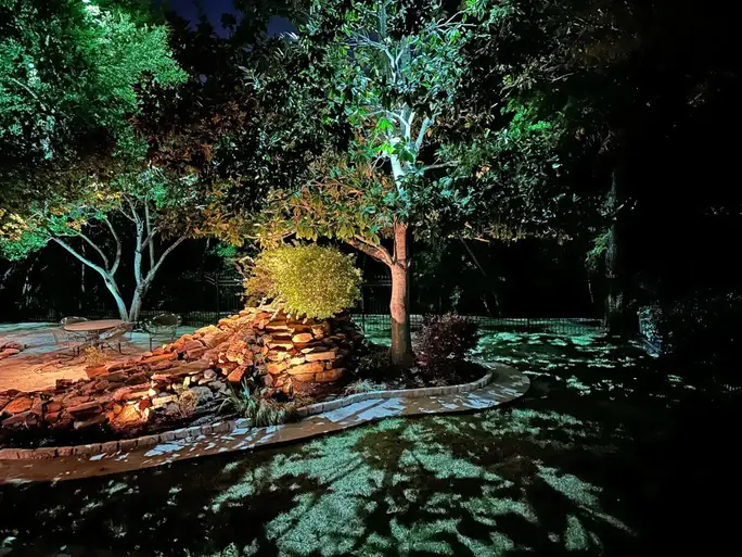 Landscape lighting by TC Lighting in Colleyville, TX — photographed after dark on the property