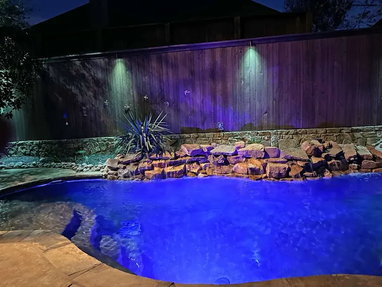 Landscape lighting by TC Lighting in Colleyville, TX — photographed after dark on the property