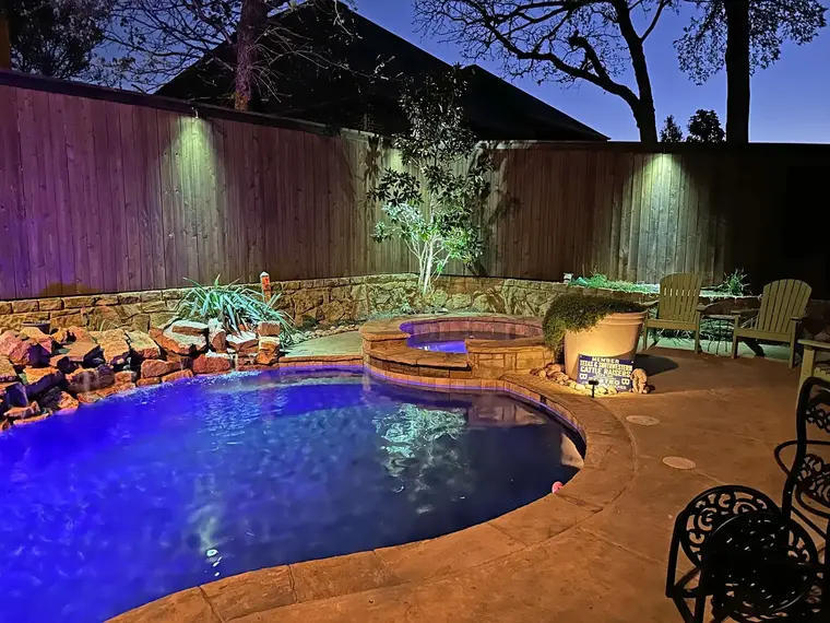 Landscape lighting by TC Lighting in Colleyville, TX — photographed after dark on the property