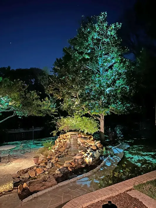 Landscape lighting by TC Lighting in Colleyville, TX — photographed after dark on the property