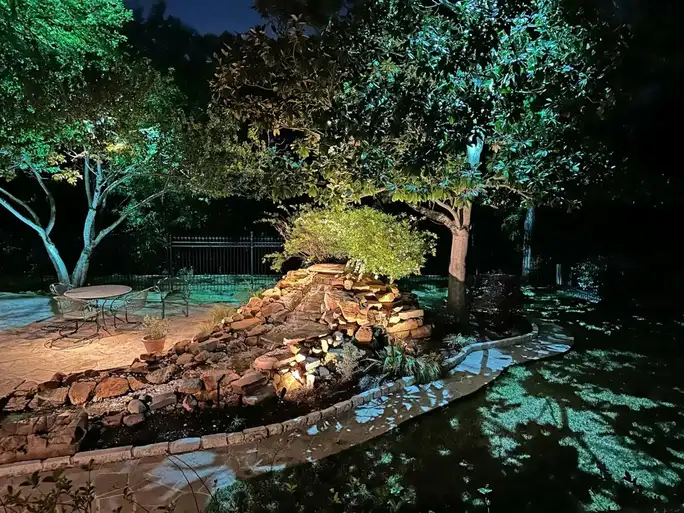 Landscape lighting by TC Lighting in Colleyville, TX — photographed after dark on the property