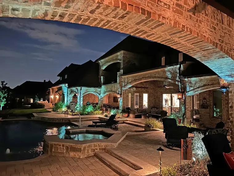 Landscape lighting by TC Lighting in Dallas, TX — photographed after dark on the property