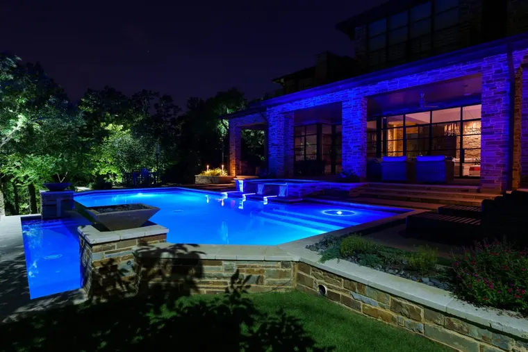 Landscape lighting by TC Lighting in Flower Mound, TX — photographed after dark on the property