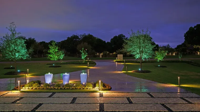 Landscape lighting by TC Lighting in Flower Mound, TX — photographed after dark on the property