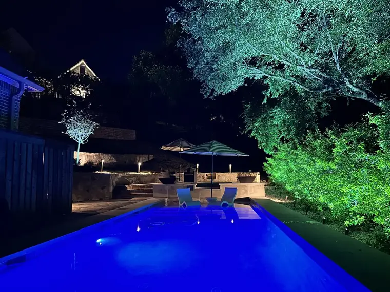 Landscape lighting by TC Lighting in Fort Worth, TX — photographed after dark on the property