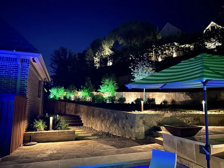 Landscape lighting by TC Lighting in Fort Worth, TX — photographed after dark on the property