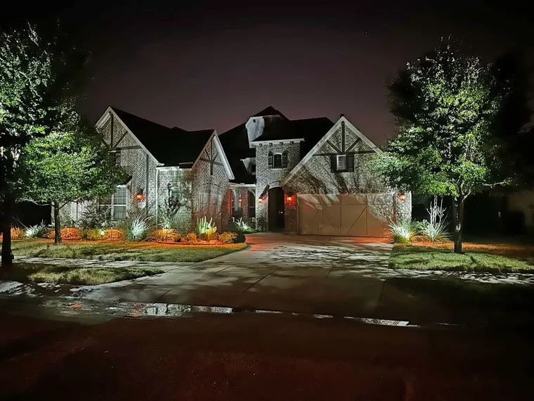 Landscape lighting by TC Lighting in Grapevine, TX — photographed after dark on the property