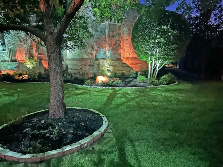 Landscape lighting by TC Lighting in Preston Hollow, Dallas, TX — photographed after dark on the property