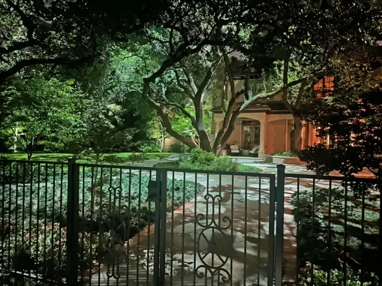Landscape lighting by TC Lighting in Preston Hollow, Dallas &mdash; photographed after dark on the property