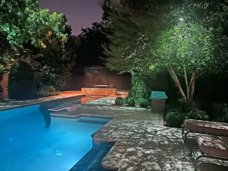 Landscape lighting by TC Lighting in Preston Hollow, Dallas &mdash; photographed after dark on the property